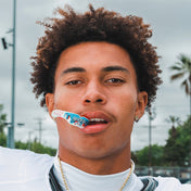 Youth Football Athlete Wearing ICEE Gel Max Power Flavor Fusion Mouthguard