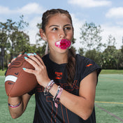 Youth Female Flag Football Athlete Wearing Shock Doctor Translucent Pink Max AirFlow Football Lip Guard