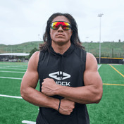 Youth Football Player Wearing Shock Doctor Performance Sleeveless Hoodie in Black