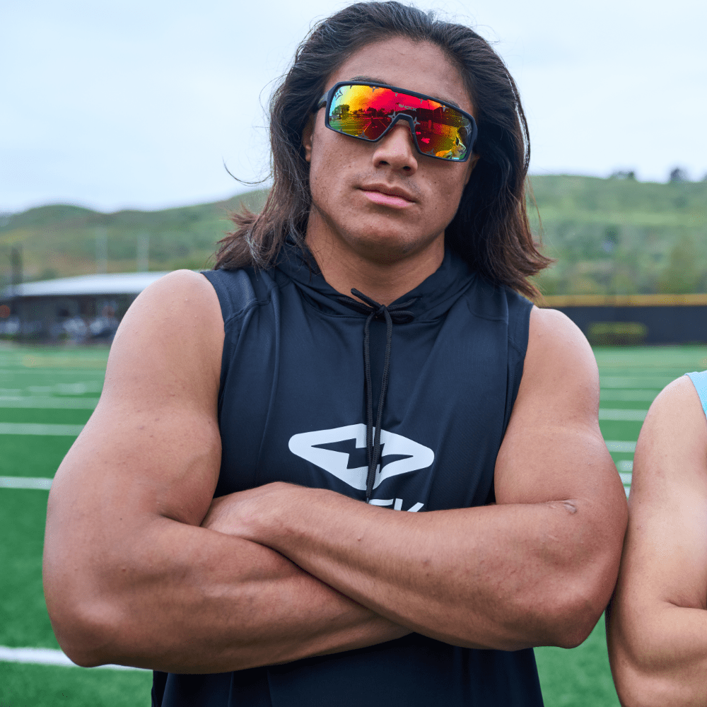 Youth Football Player Wearing Shock Doctor Performance Sleeveless Hoodie in Black