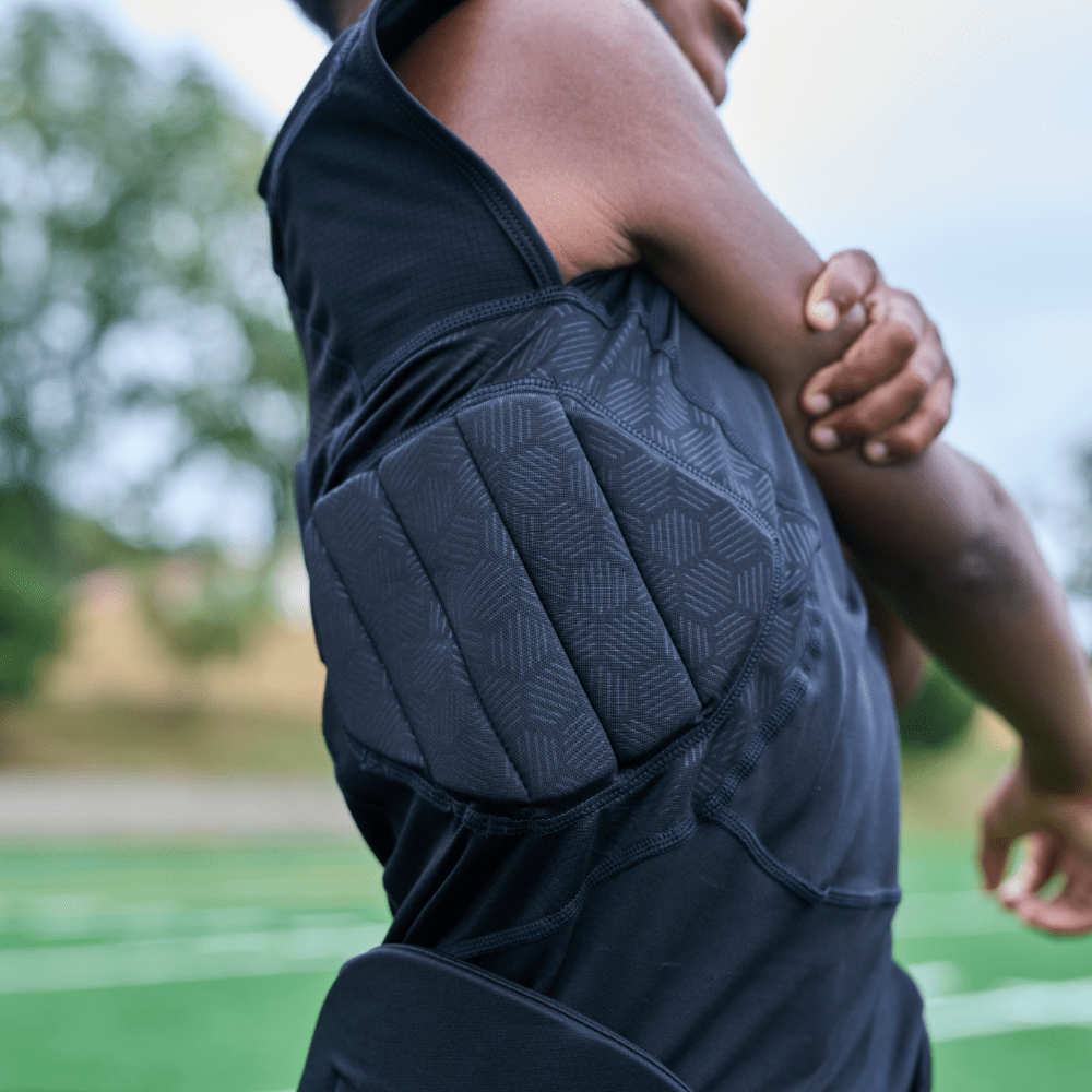 Detail View of Youth Football Athlete Wearing Shock Doctor Showtime 5-Pad Black Top With Padding