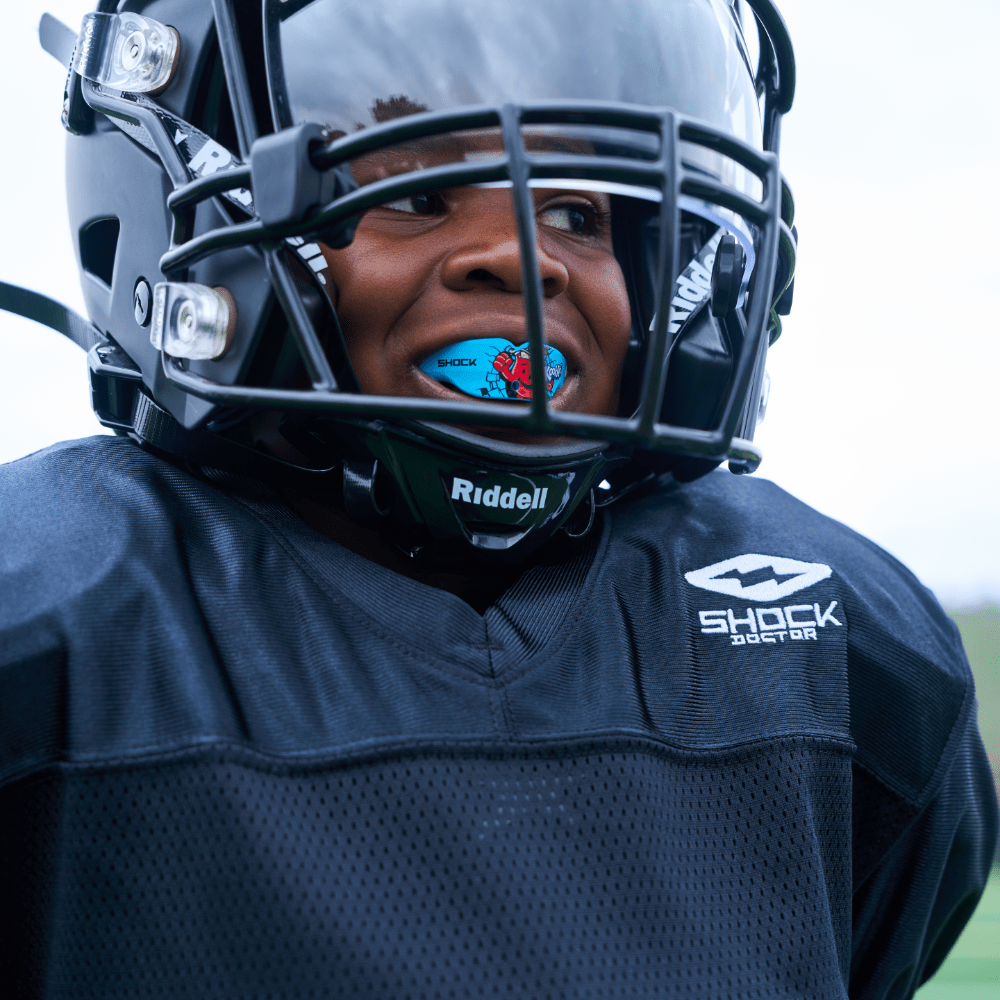 Detail View of Youth Tackle Football Athlete Wearing Shock Doctor Showtime Black Practice Jersey