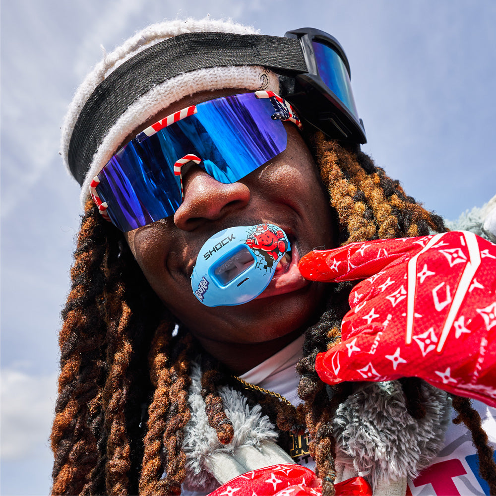 Youth 7v7 Football Player Wearing Shock Doctor Kool Aid Max AirFlow Football Mouthguard (Tropical Punch Flavor)