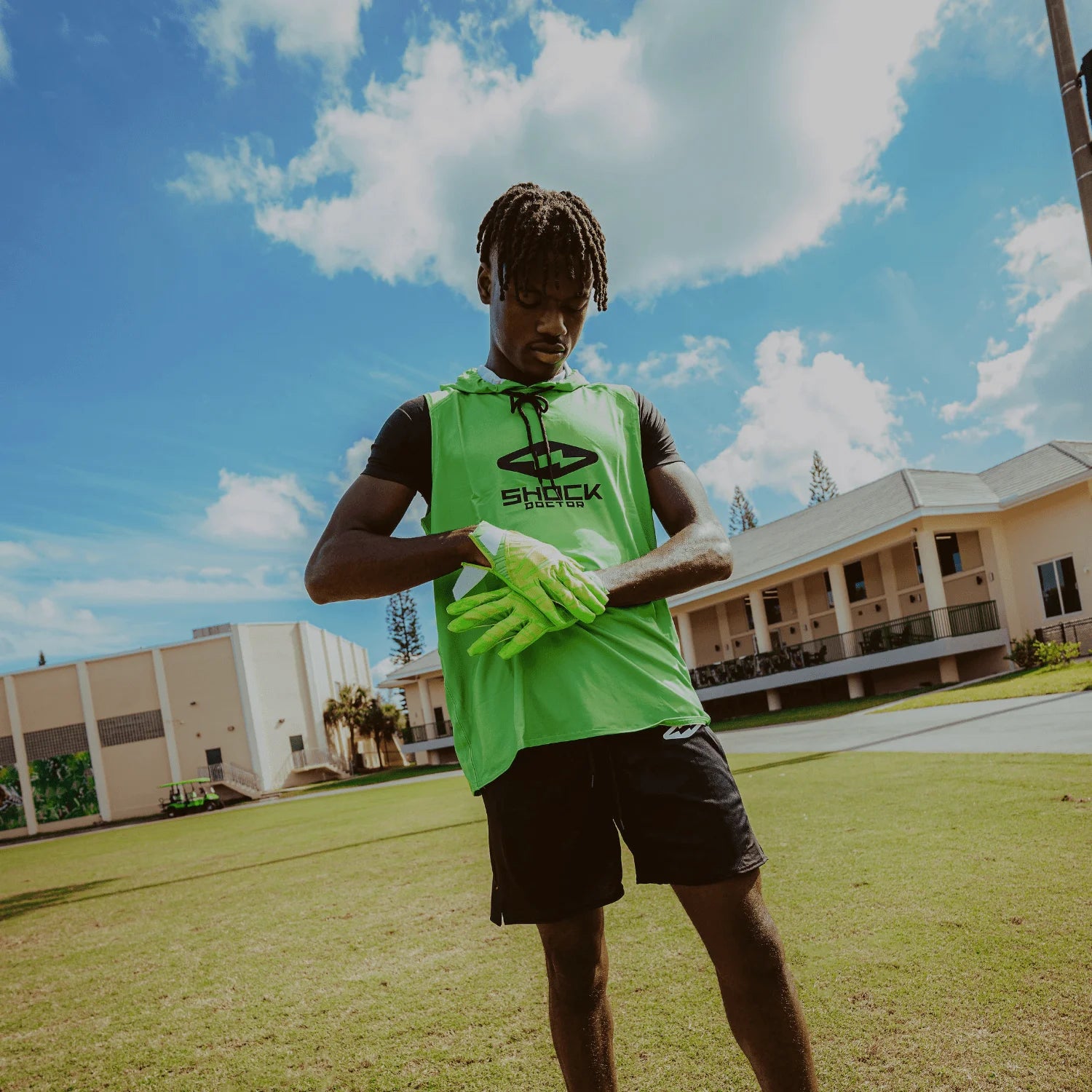 Outlet Collection - Image Features Youth 7v7 Football Athlete Wearing Shock Doctor Performance Sleeveless Hoodie (Shock Green Color) and Rev Pro 6.0 Football Receiver Gloves (Shock Green Color)