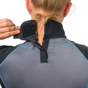 Shock Doctor Women's Ultra Compression Short Sleeve Hockey Shirt with Integrated Neck Guard - Black - On Model - Detail View of Back of Neck Guard on Female Hockey Player (Pulling Velcro Strap)