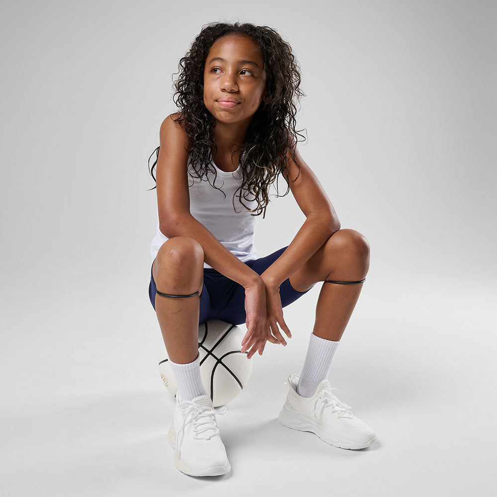 Shock Doctor Silicone Patella Band Pair - Black - Shown on Model Sitting on Basketball