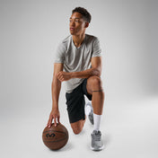 Shock Doctor Silicone Patella Band Pair - Black - Shown on Model Kneeling with Basketball