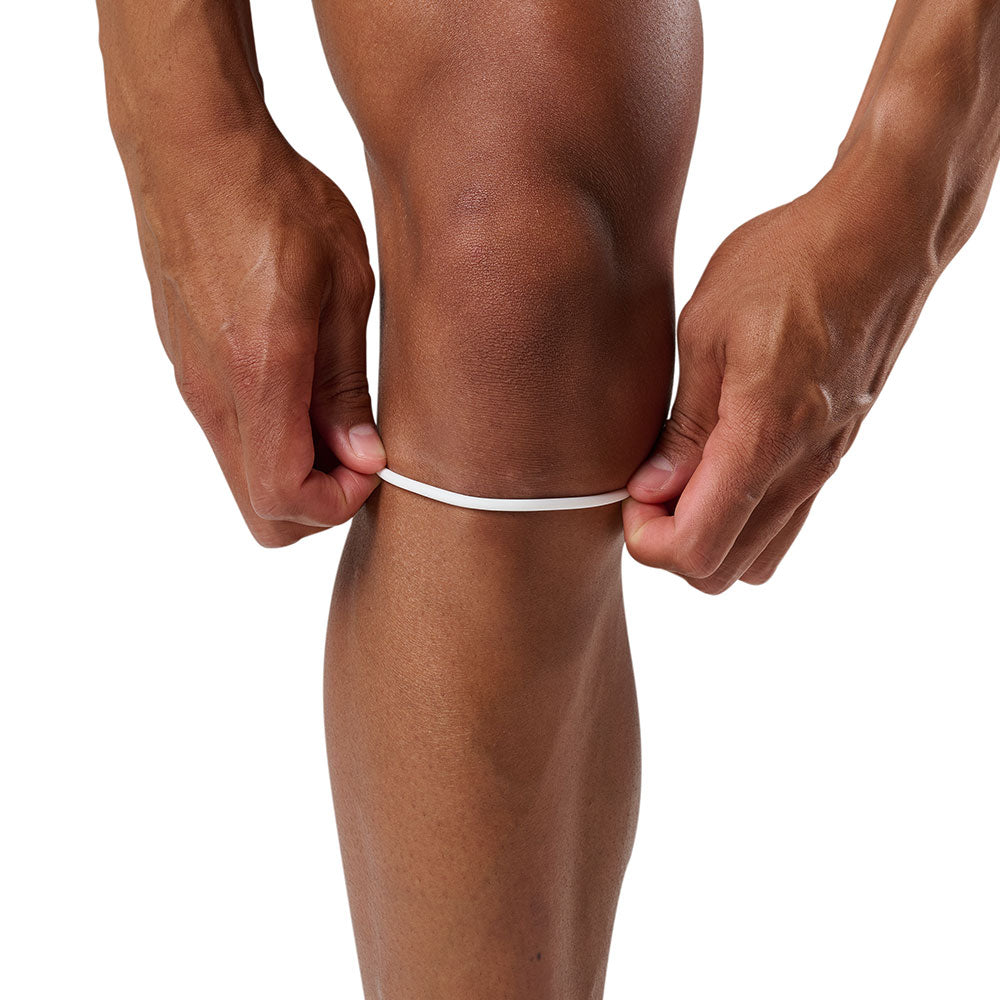 Shock Doctor Silicone Patella Band Pair - White - Shown on Model Pulling Up Band on Knee