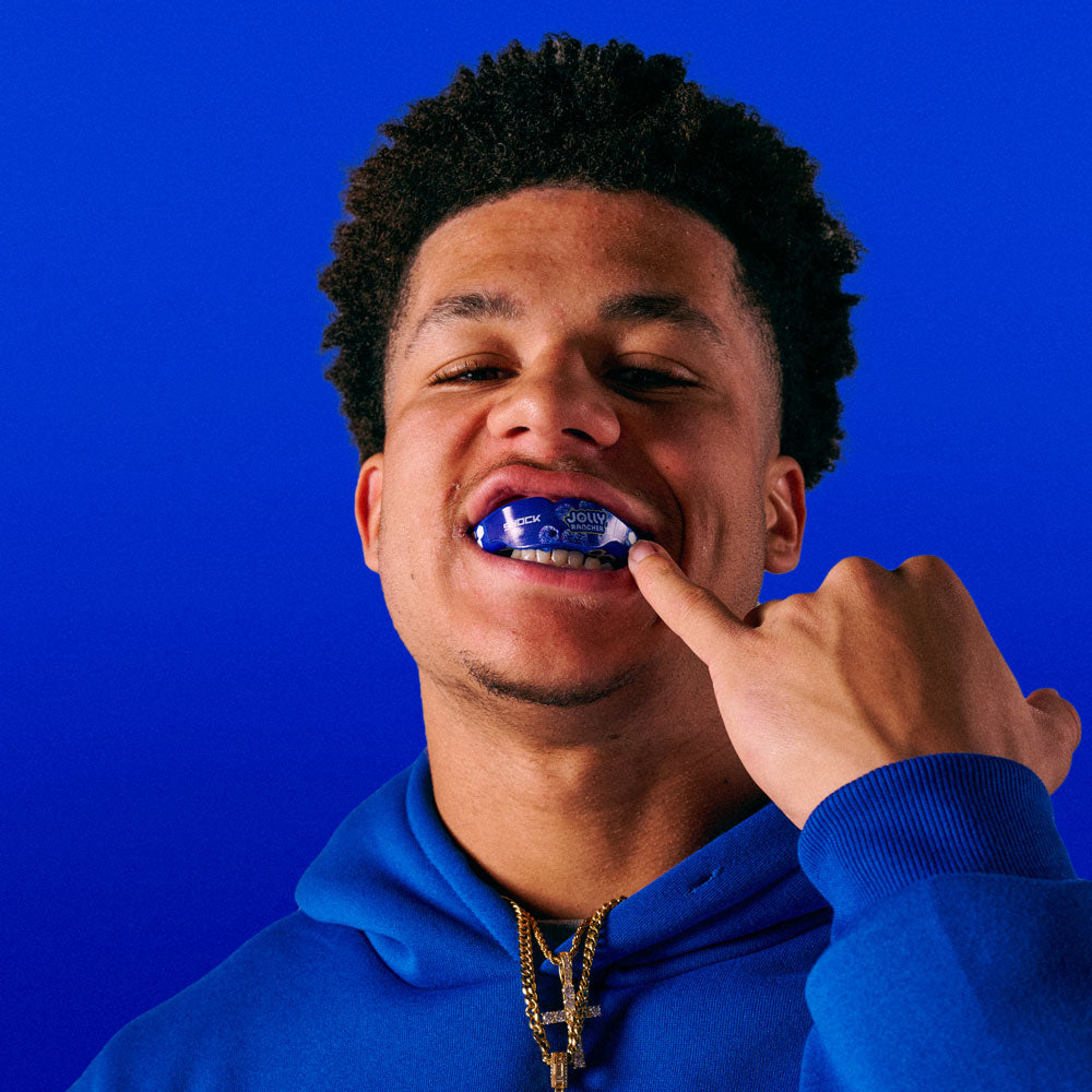 Youth Athlete Wearing Jolly Rancher Gel Max Power Flavor Fusion Mouthguard (Blue Raspberry Flavor)