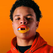 Youth Athlete Wearing Shock Doctor Jolly Rancher Max AirFlow Football Mouthguard (Mango Flavor)