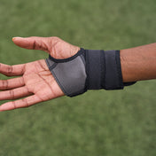 Athlete Showcasing Shock Doctor Wrist 3-Strap Support (Open Palm View)