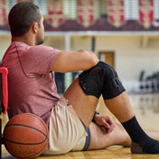 Basketball Athlete Wearing Shock Doctor Knee Support with Dual Hinges