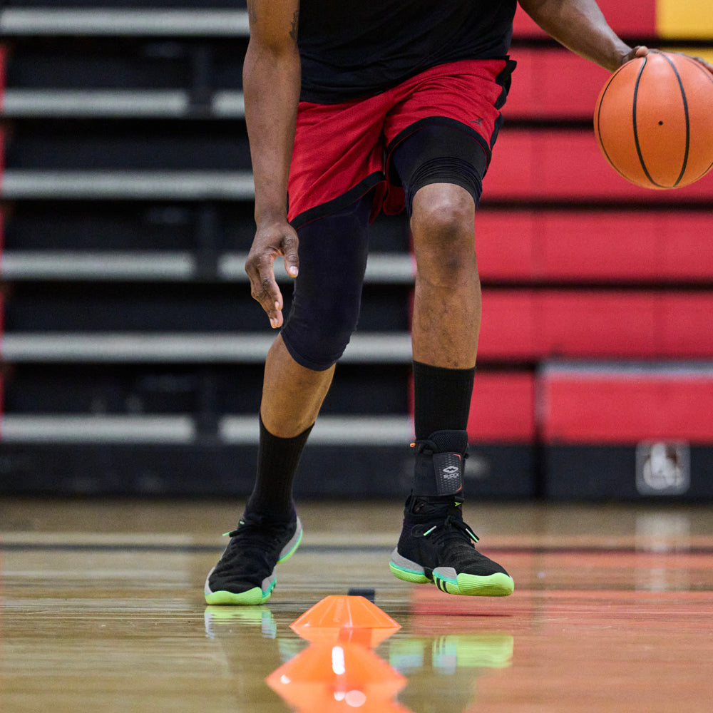 Athlete Running Basketball Drills While Wearing Shock Doctor Ultra Wrap Lace Ankle Support