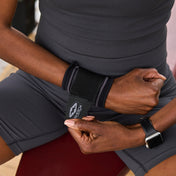 Athlete Strapping on Shock Doctor Compression Knit Wrist Sleeve with Strap