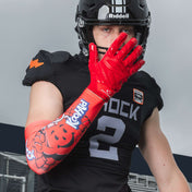 Youth Tackle Football Athlete Catching Football While Wearing Shock Doctor Showtime Kool-Aid Cherry Red Compression Arm Sleeve and Force 6.0 Lineman Glove