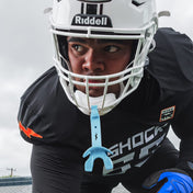 Male Football Athlete Wearing Shock Doctor Columbia Blue Bolt Football Lip Guard