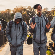 2 Youth Football Players Wearing Shock Doctor Athletic Zip-Up Hoodie in Grey