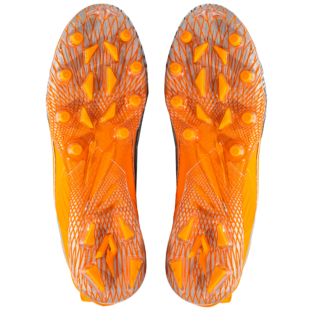 Phenom Elite Quantum Speed 2.0 football cleats in orange, bottom view of the TPU traction plate and multidirectional stud pattern