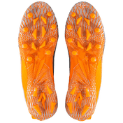 Phenom Elite Quantum Speed 2.0 football cleats in orange, bottom view of the TPU traction plate and multidirectional stud pattern