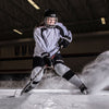 Lifestyle Shot of Female Hockey Player Wearing Protective Shock Doctor Hockey Gear