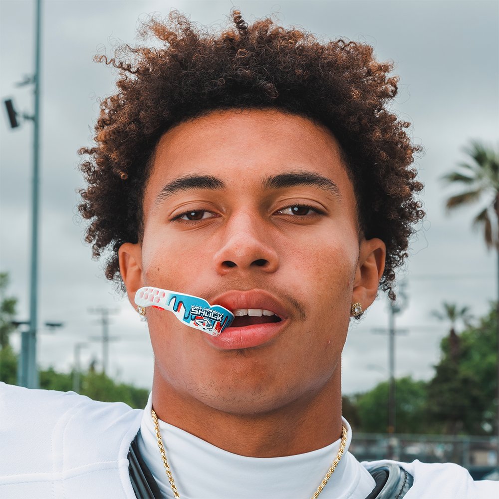 Youth Football Athlete Wearing ICEE Gel Max Power Flavor Fusion Mouthguard