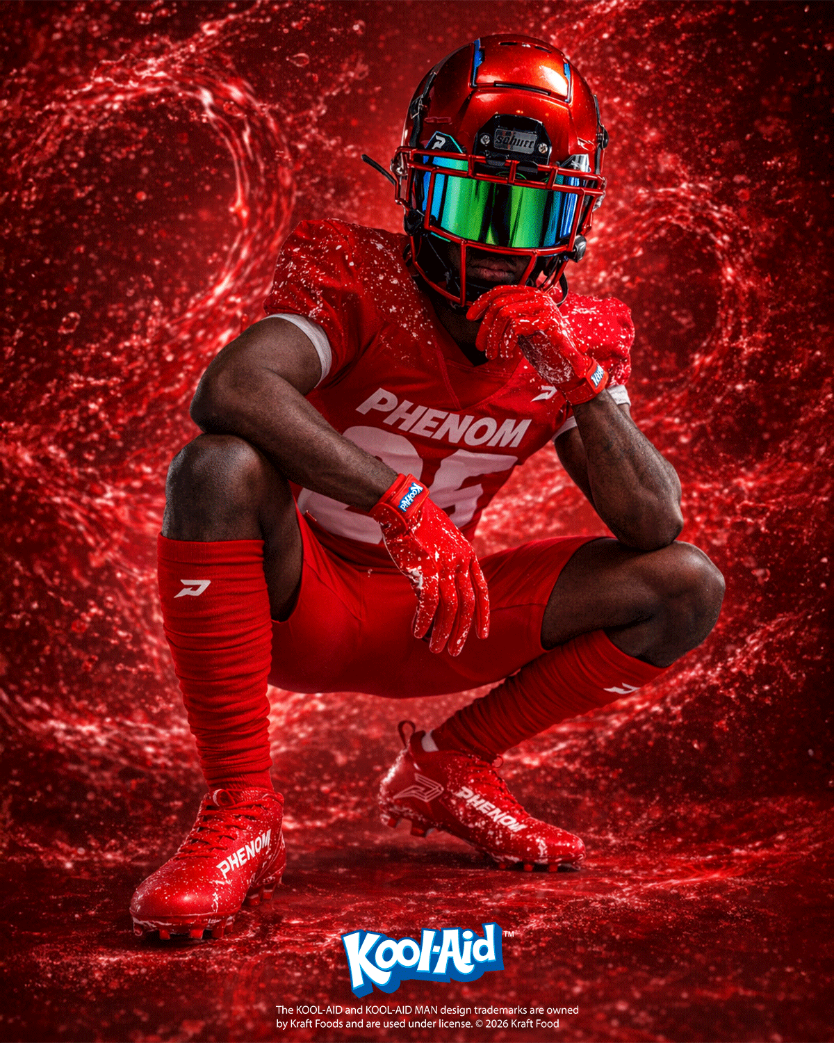 Football player crouching in a red uniform, wearing Kool-Aid Cherry Quantum Speed cleats and gloves by Phenom Elite