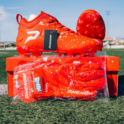 Kool-Aid Cherry cleats by Phenom Elite on the shoebox with matching Kool-Aid Phenom football gloves