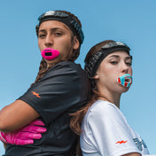 Two Youth Flag Football Athletes Wearing a Shock Doctor Pink Max AirFlow Lip Guard and an ICEE Max AirFlow Lip Guard (both are wearing a Shock Doctor Protective HEX® Headband