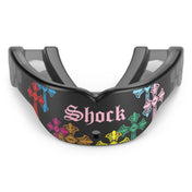 Front view of the Shock Doctor Gel Max Power Print mouthguard in Divine Drip. Black mouthguard featuring multicolored gothic crosses in pink, red, blue, green, orange, and yellow wrapping the front, with "Shock" in pink Old English lettering and a center breathing hole.
