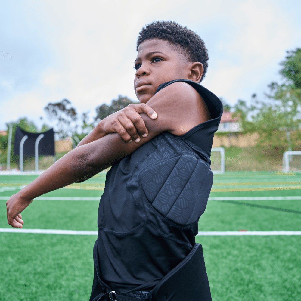 Youth Football Athlete Wearing Shock Doctor Showtime 5-Pad Black Top 