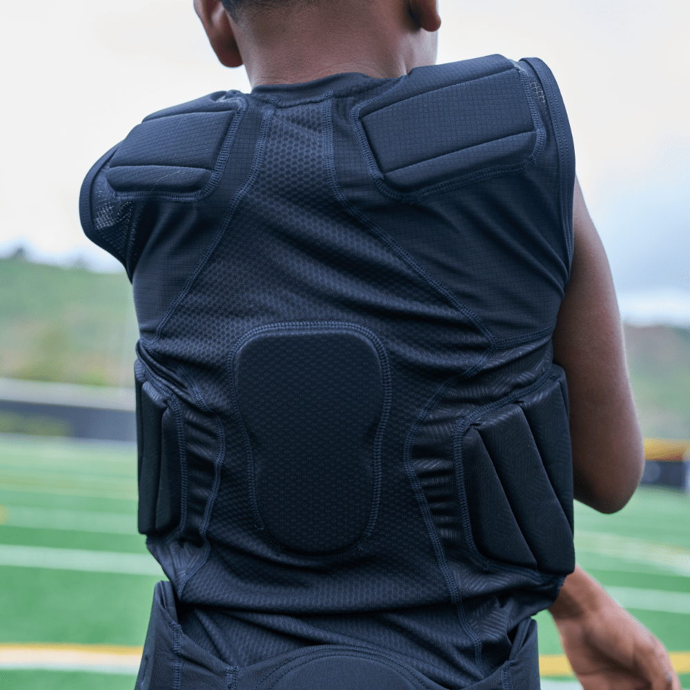 Back View of Youth Football Athlete Wearing Shock Doctor Showtime 5-Pad Black Top 