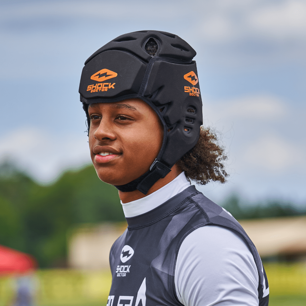 Shock Doctor Showtime Showtime Soft Shell Protective Headgear - Lifestyle Detail Shot on Youth Football Player Wearing Headgear