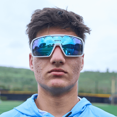 Shock Doctor Showtime Sunglasses - White Frame & Blue Lenses - Lifestyle Shot on Youth 7v7 Football Player