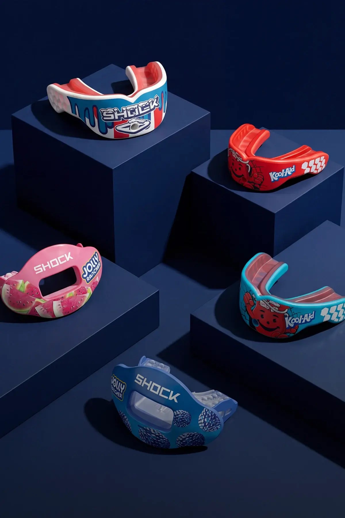 Colorful mouthguards on a dark blue geometric background