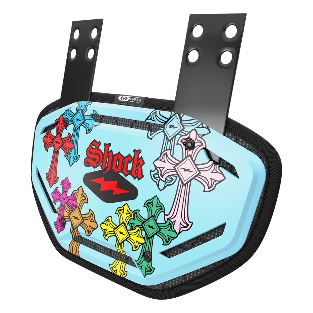 Shock Doctor Showtime Divine Drip football back plate in light blue with a multicolor gothic cross graphic print and pink "Shock" logo, featuring vented HEX shell construction and adjustable mounting straps.