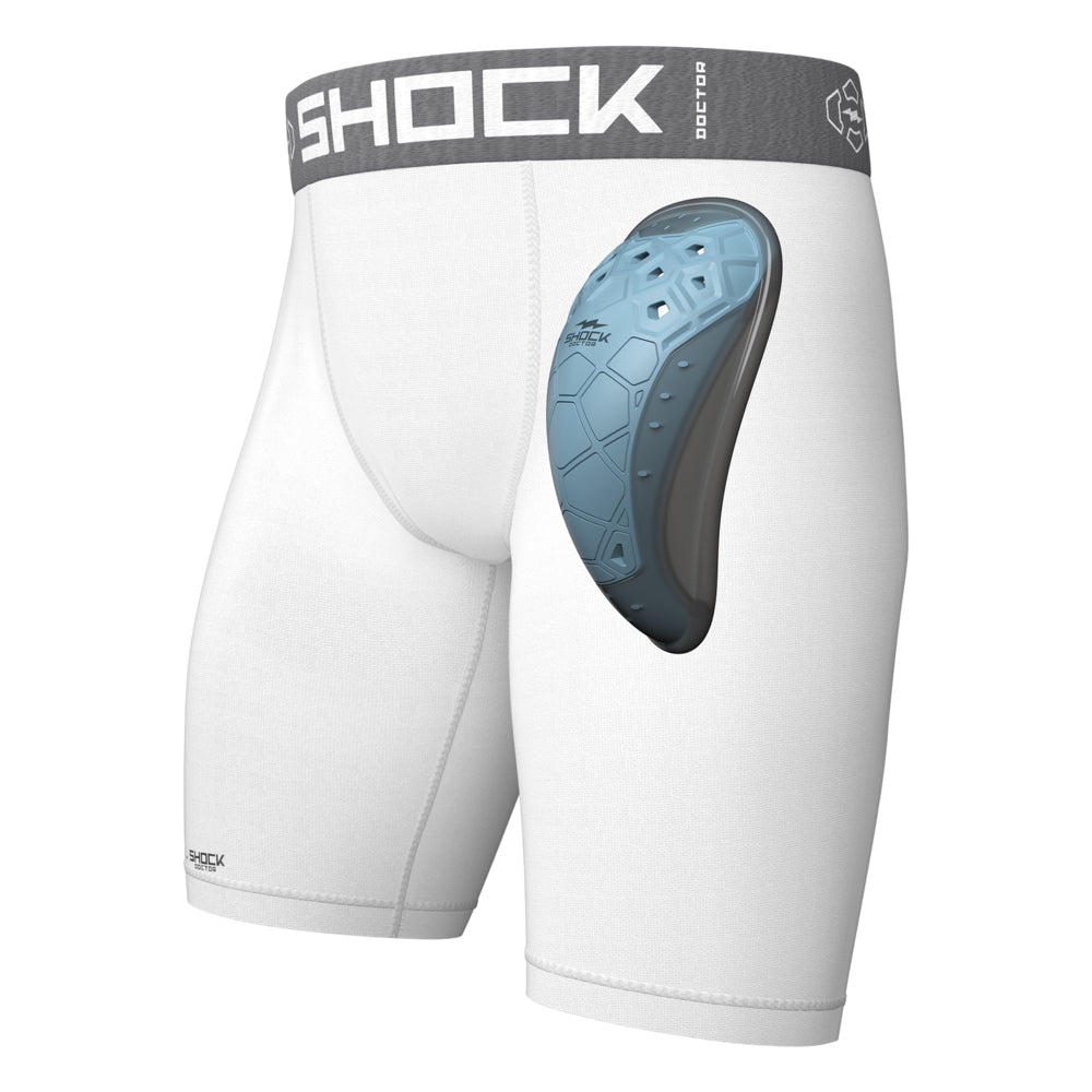 Shock Doctor Core Compression Short with BioFlex 2.0 Cup in white, front three-quarter view showing fitted compression short with BioFlex 2.0 protective cup inserted at the front