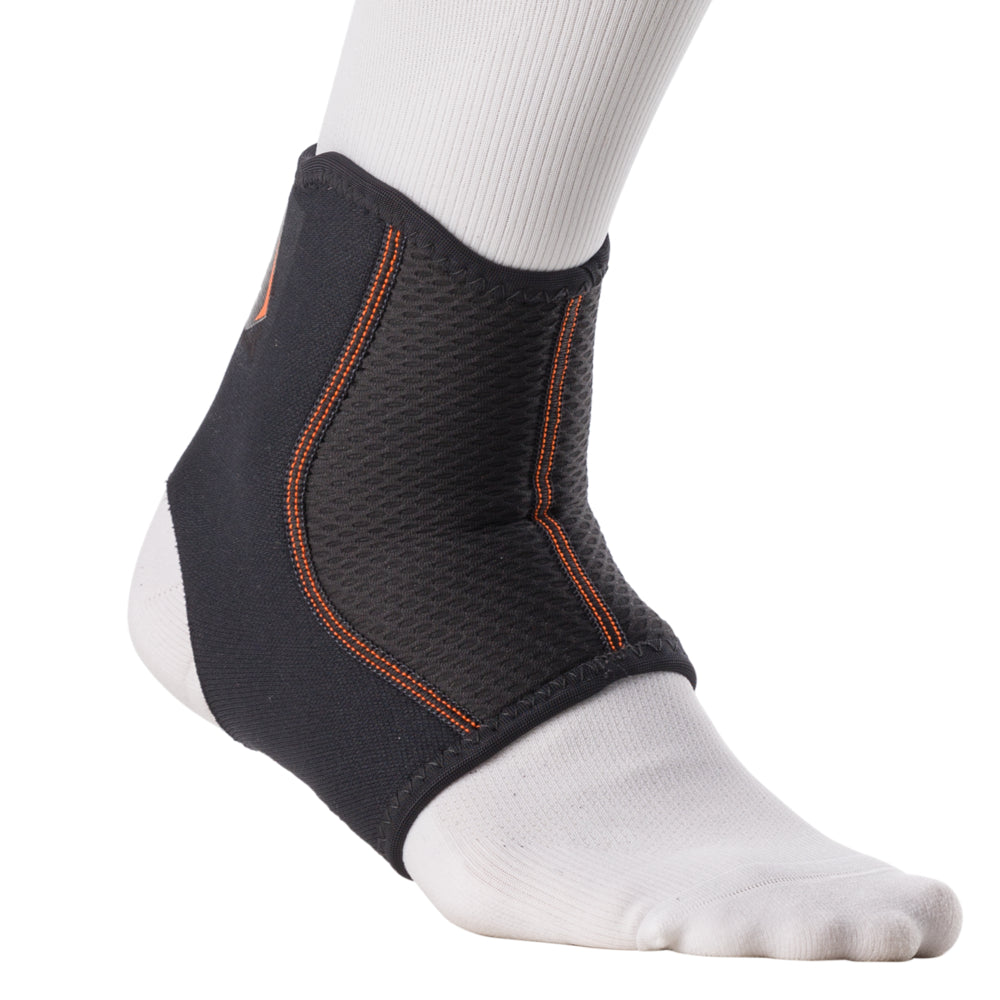 Shock Doctor Ankle Sleeve worn on foot, side view showing low-profile compression coverage