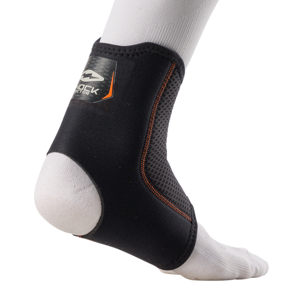 Shock Doctor Ankle Sleeve worn on foot, back view showing compression fit around the heel and Achilles