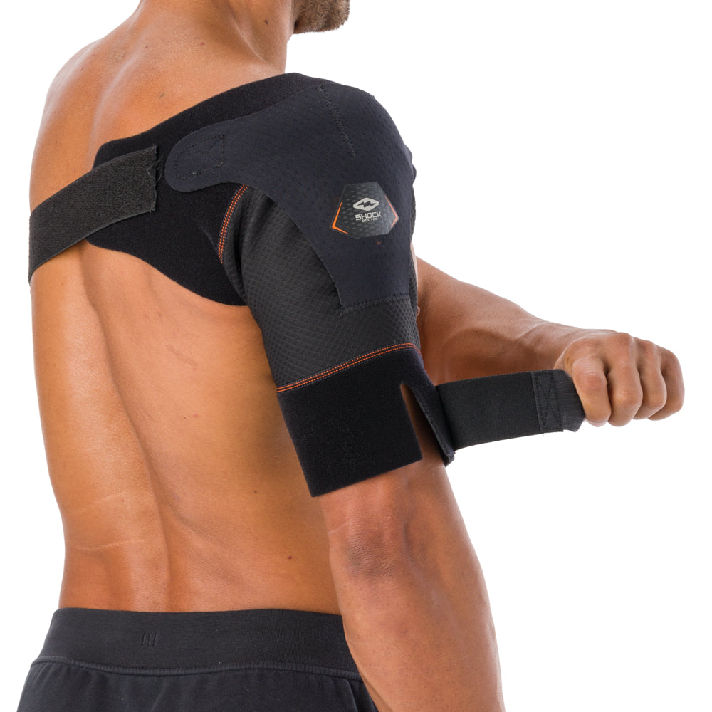 Shock Doctor Shoulder Wrap worn on the shoulder from a rear side angle, showing the underarm strap and front panel