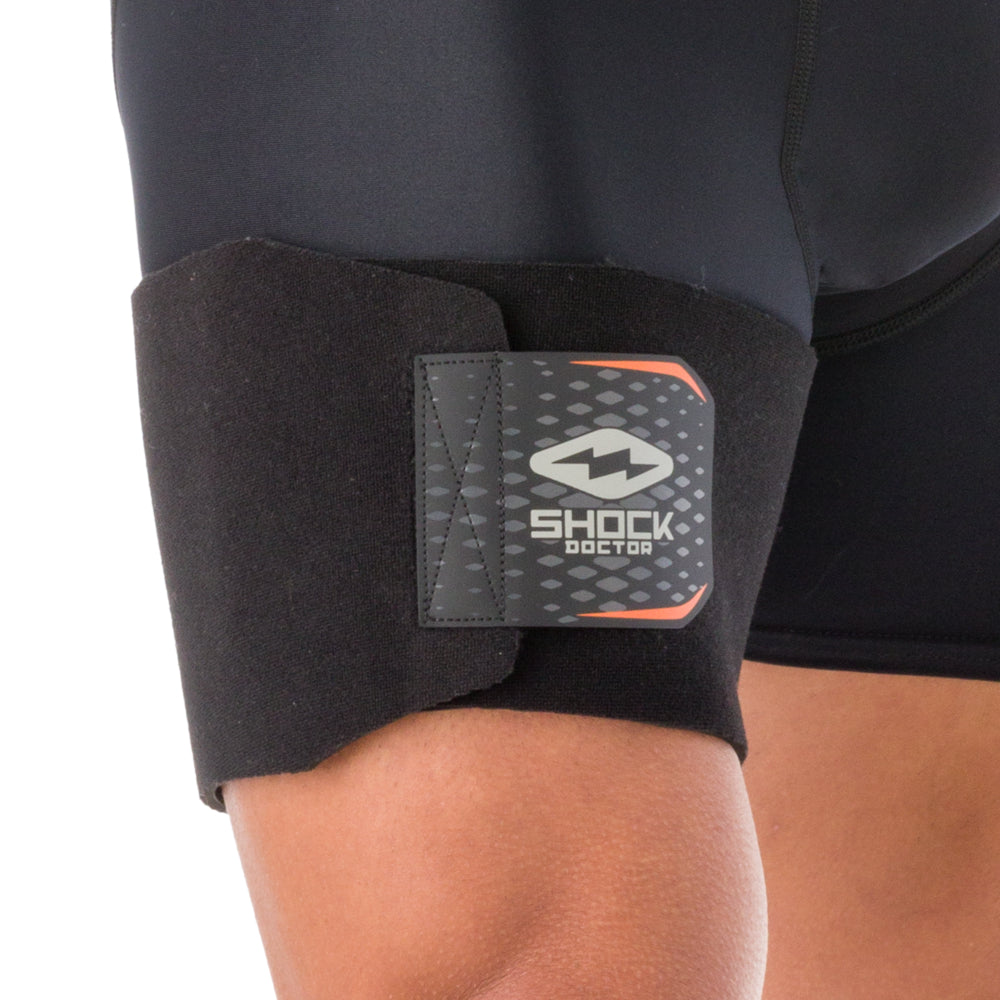 Shock Doctor Adjustable Groin Wrap worn on the upper thigh, close-up front view showing logo and closure tab