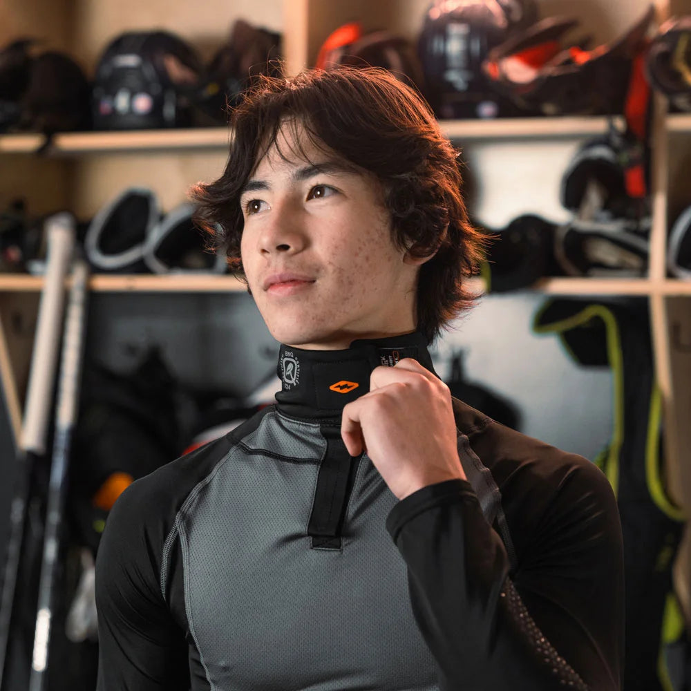 Youth Hockey Player Wearing Shock Doctor Protective Shirt with Neck Guard