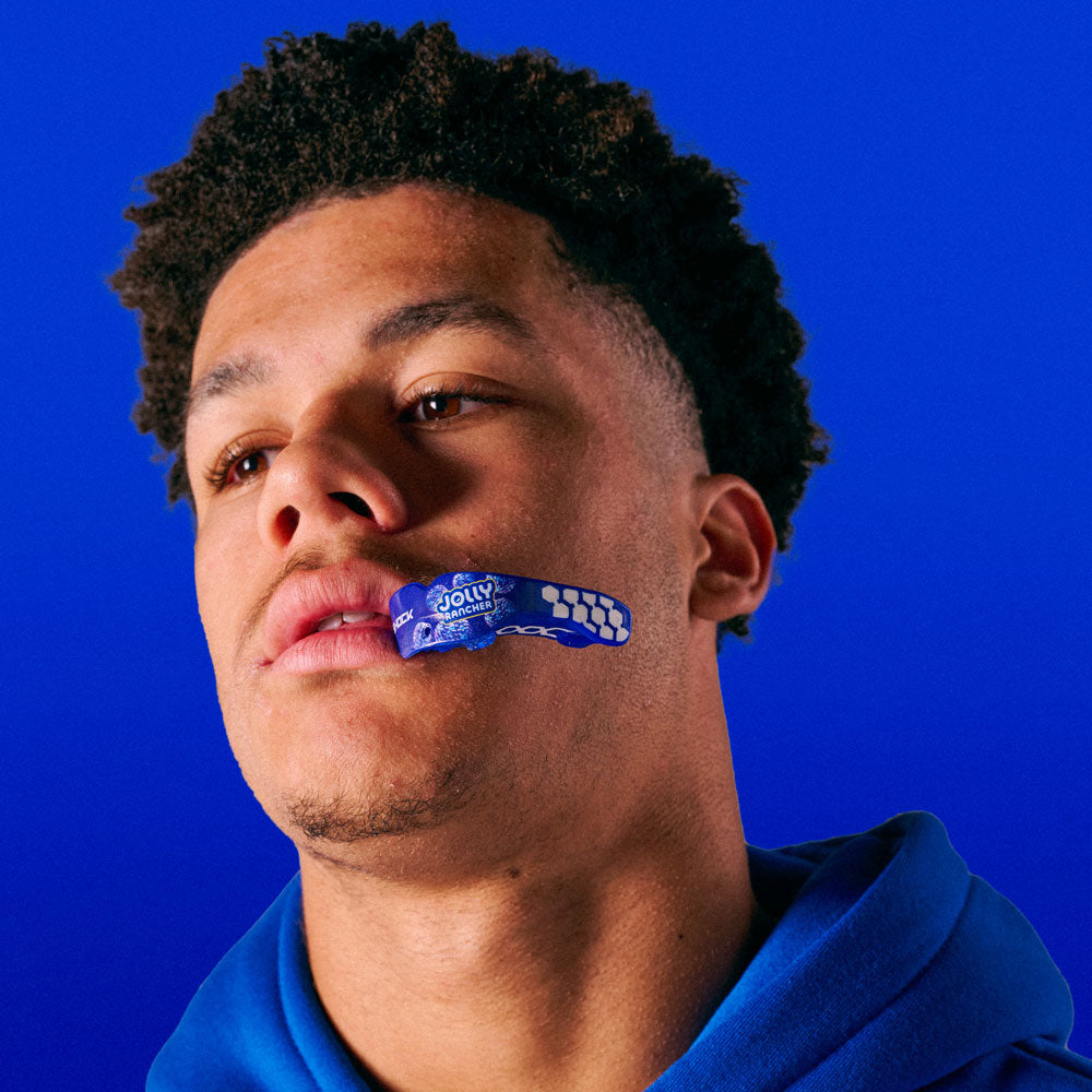 Youth Athlete Wearing Jolly Rancher Gel Max Power Flavor Fusion Mouthguard (Blue Raspberry Flavor)