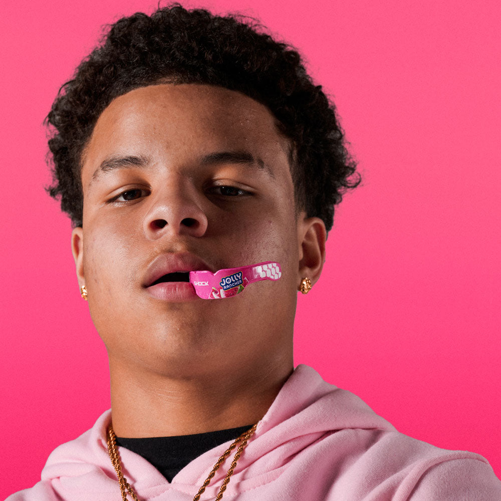 Youth Athlete Wearing Jolly Rancher Gel Max Power Flavor Fusion Mouthguard (Watermelon Flavor)