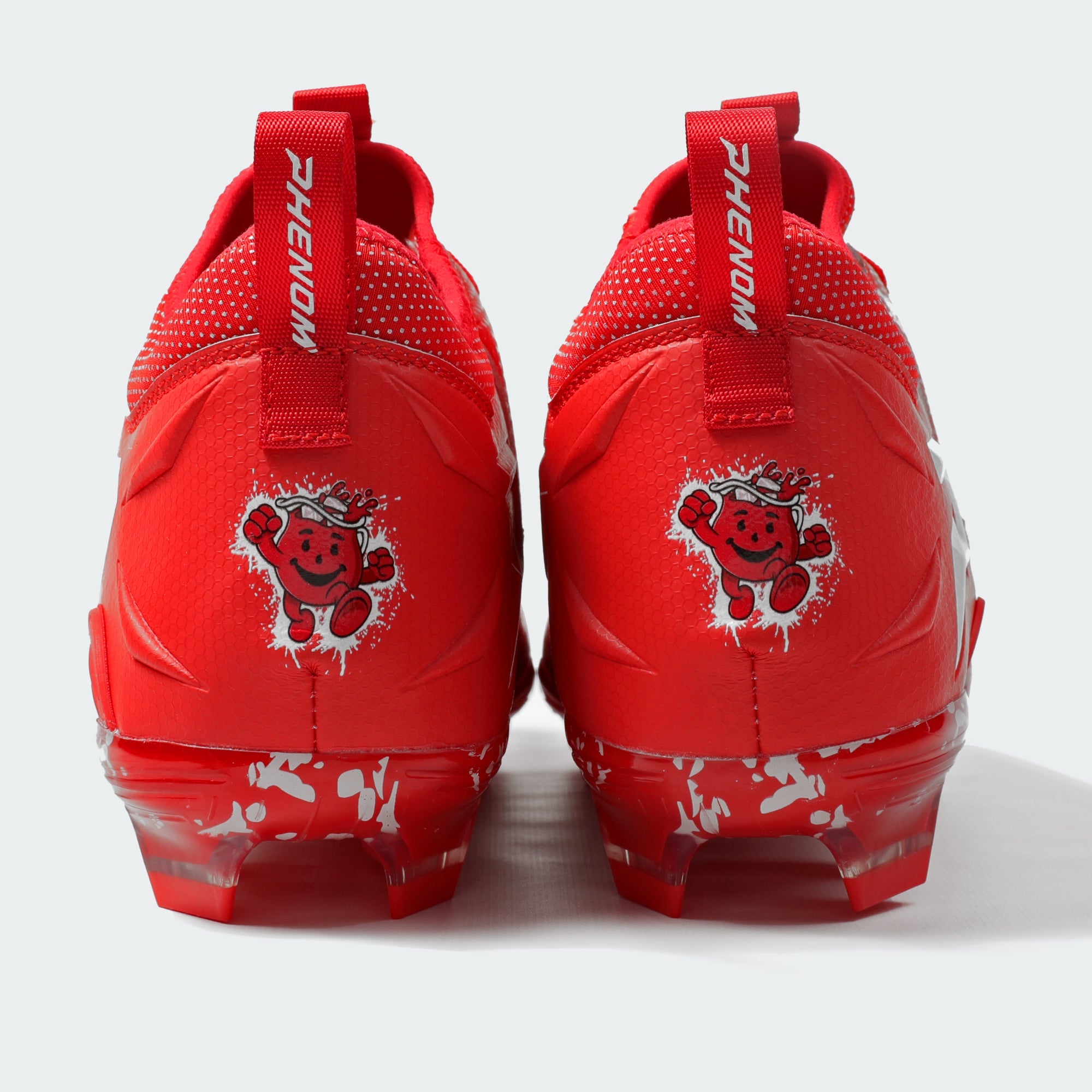Kool-Aid Cherry Quantum Speed cleats by Phenom Elite, heel view showing Kool-Aid Man graphic and PHENOM pull tabs
