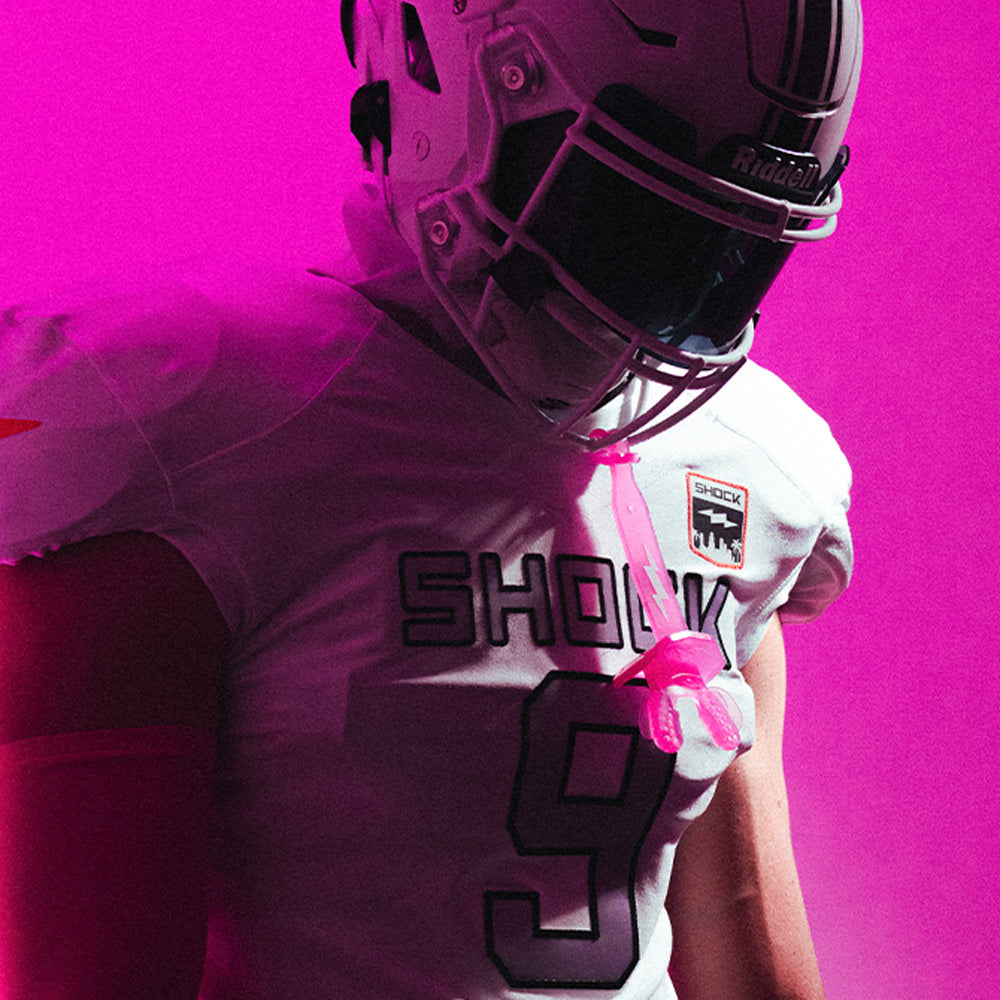 Tackle Football Player Wearing Shock Doctor Thunder Bolt Lip Guard (Translucent Pink Color)