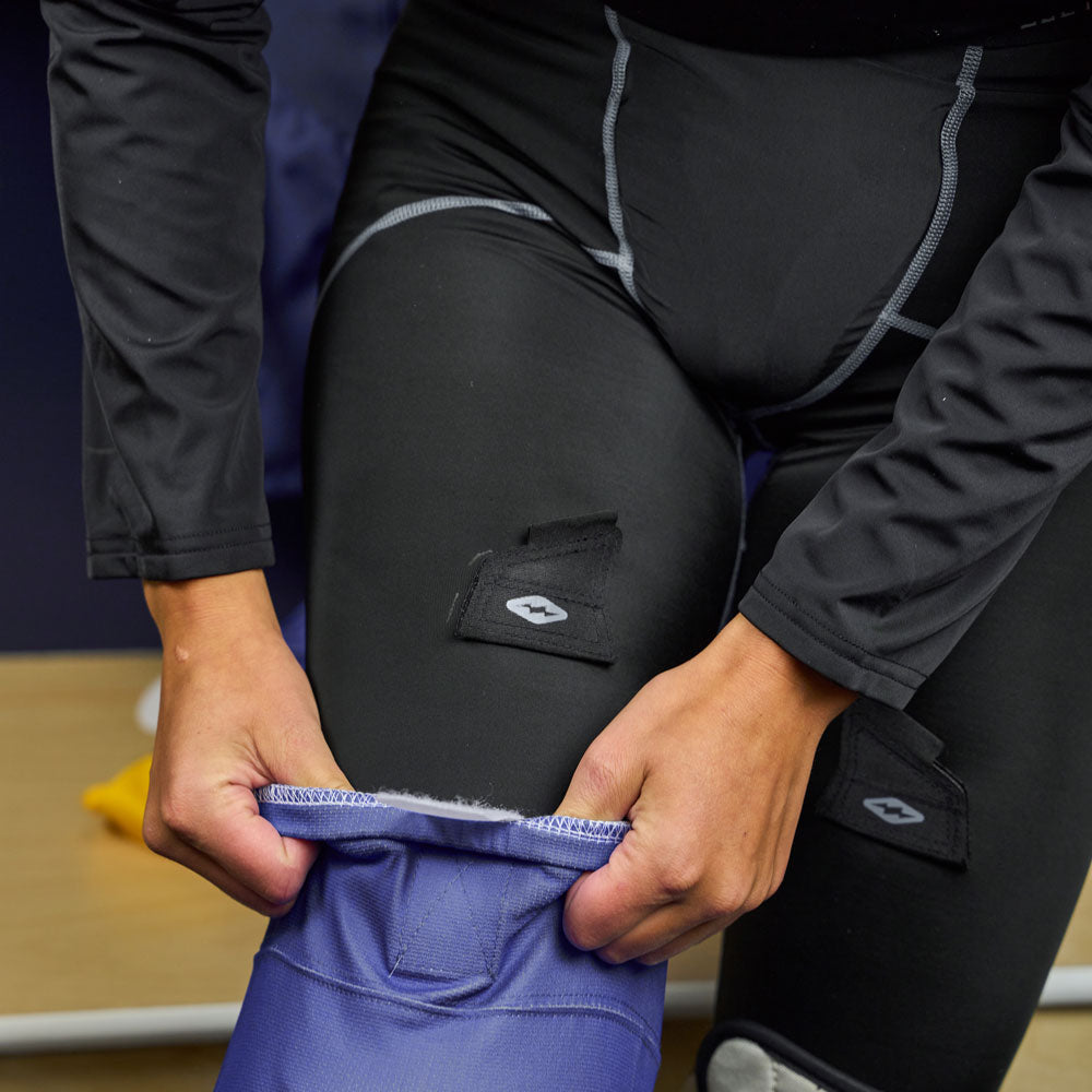 Lifestyle Shot of Female Hockey Player Wearing Shock Doctor Women's Compression Hockey Pant With Pelvic Protector