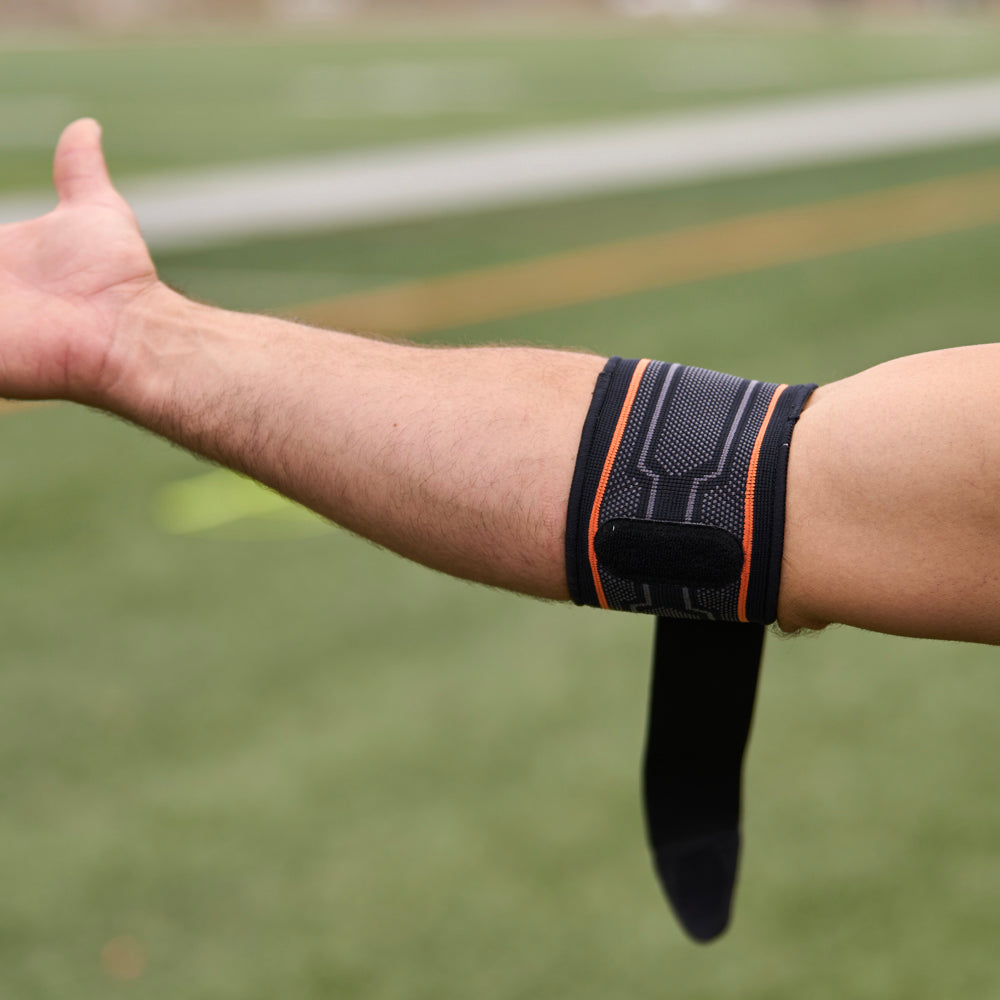 Shock Doctor Compression Knit Tennis/Golf Elbow Sleeve with Gel Support & Strap - On Model - Detail View with Loose Strap