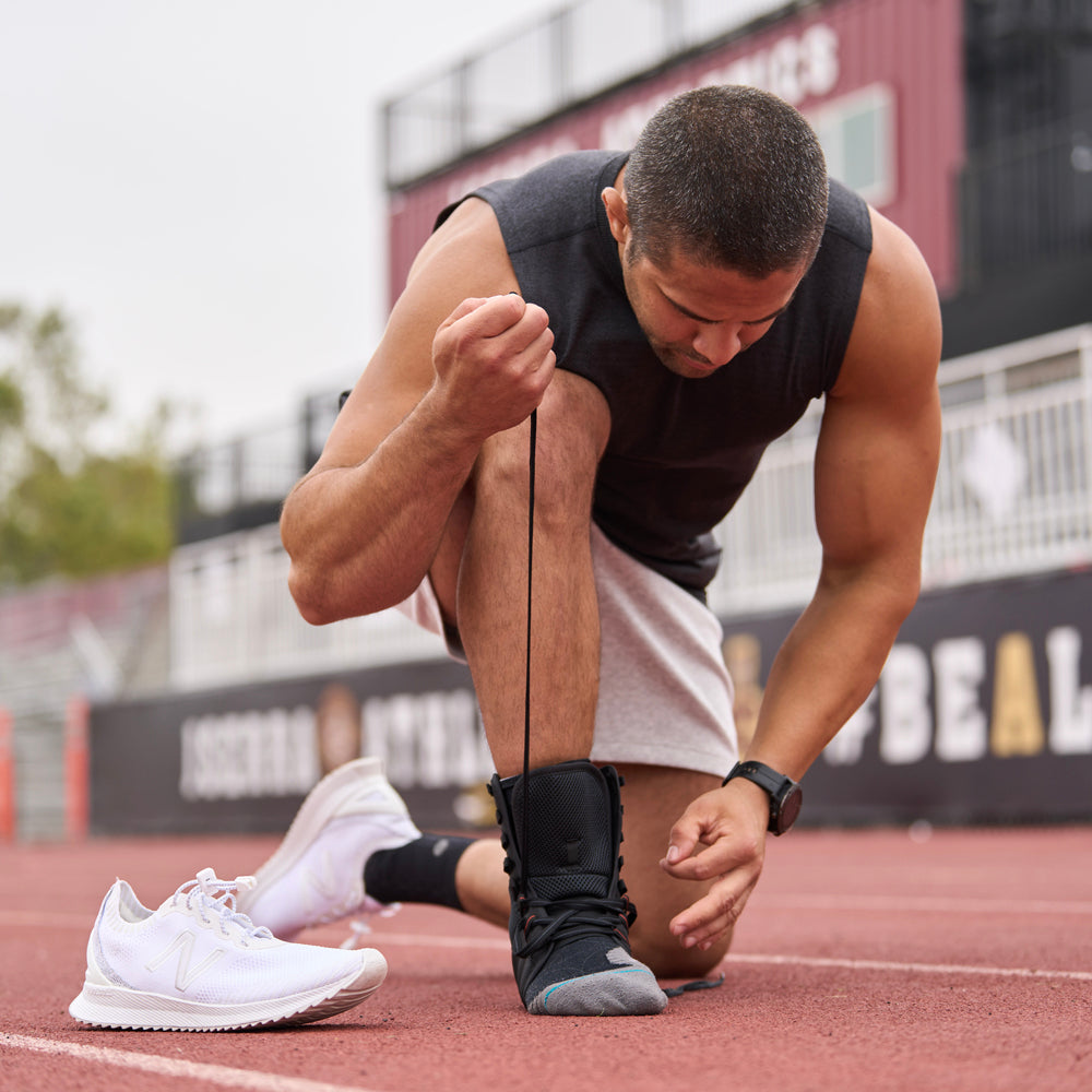 Athlete Lacing Up Shock Doctor Ultra Gel Lace Ankle Support for  a Better Fit