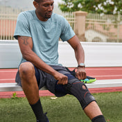 Athlete Adjusting the Shock Doctor Knee Stabilizer with Flexible Support Stays for a Better Fit