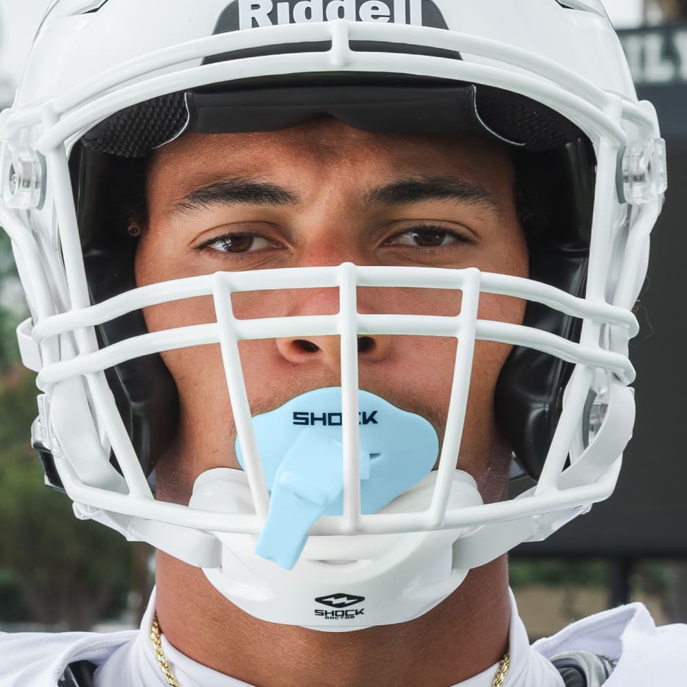 Male Football Athlete Wearing Shock Doctor Columbia Blue Bolt Football Lip Guard